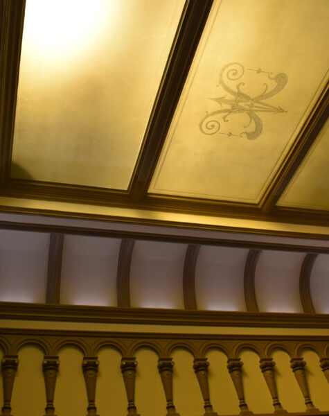 Glass ceiling of the stairwell with sandblasted logo